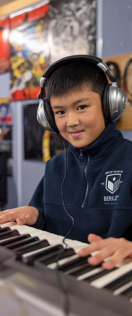 Report An Absence Student Playing an Electronic Keyboard